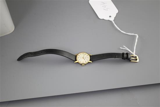 A ladys steel and gold plated Omega manual wind wrist watch, on associated leather strap.